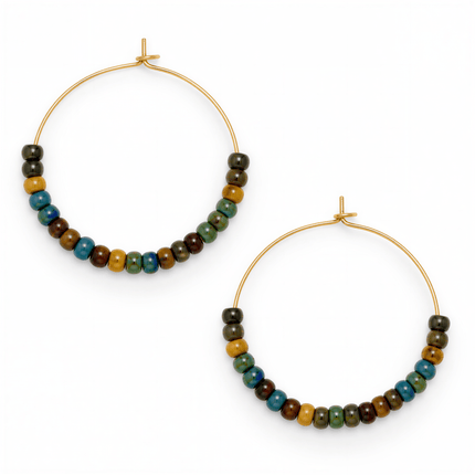 Two gold metal hoop earrings featuring multicolored round glass beads in blue, green, and brown on a white background.