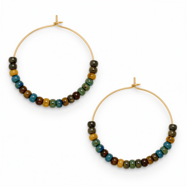 Two gold metal hoop earrings featuring multicolored round glass beads in blue, green, and brown on a white background.