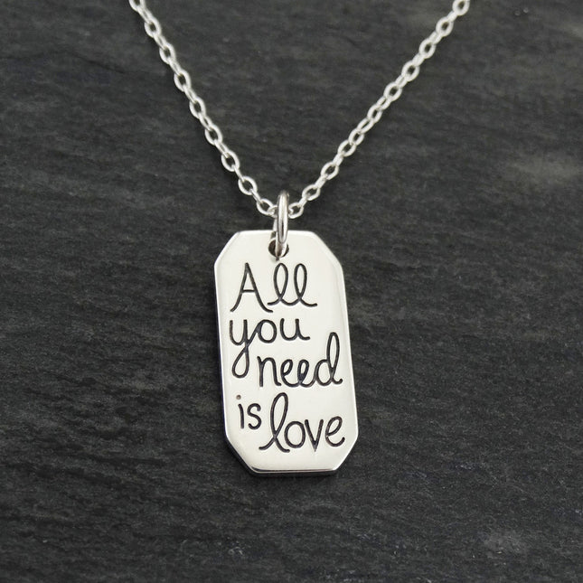 “All You Need Is Love” Necklace – Sterling Silver Quote Charm on 16" Chain