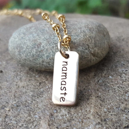 Tiny Namaste Necklace – Gold Word Tag on 16" Chain