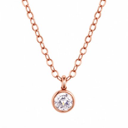 Rose gold chain necklace with a round clear stone in a bezel setting.