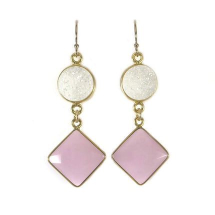 Pair of drop earrings with round white druzy and square pink stones in gold metal frames on a white background.