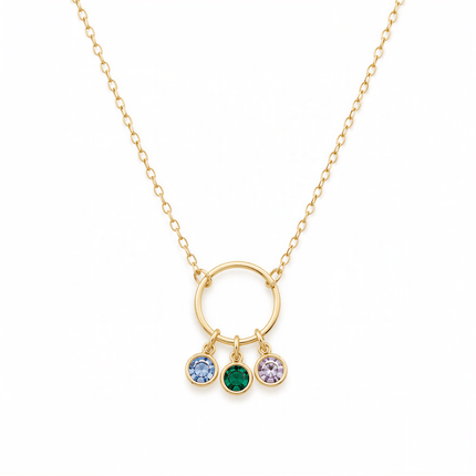Gold chain necklace with a circular pendant holding three round blue, green, and purple stones.