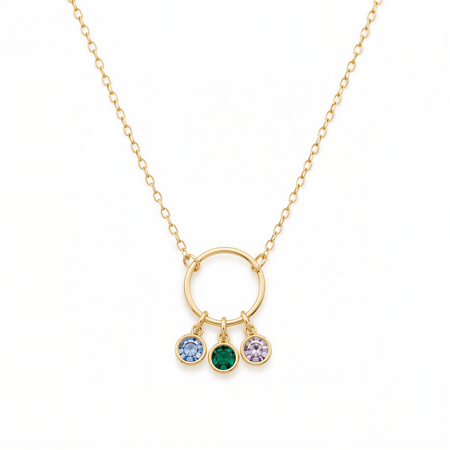 Gold chain necklace with a circular pendant holding three round blue, green, and purple stones.