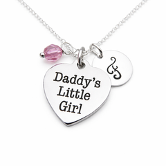 Silver heart necklace with a pink bead, initial J charm, and Daddy's Little Girl engraved on the metal heart pendant.